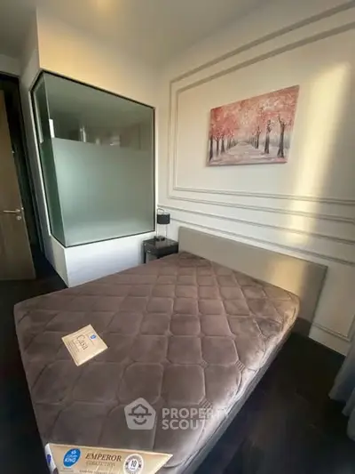 Cozy bedroom with elegant decor and a comfortable bed, perfect for relaxation.