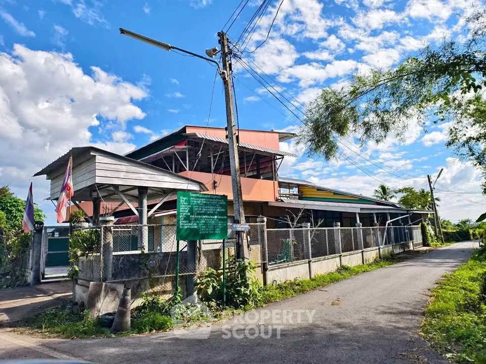 Charming rural property with spacious outdoor area and vibrant sky view.