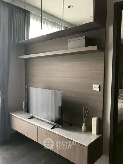 Modern living room with sleek TV unit and elegant decor