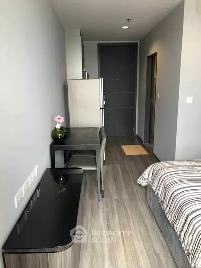 Modern studio apartment interior with sleek design and cozy ambiance.