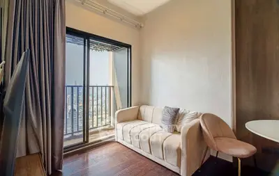 Chic living room with balcony view in modern apartment