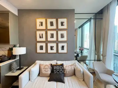 Modern living room with elegant decor and large windows offering city views.