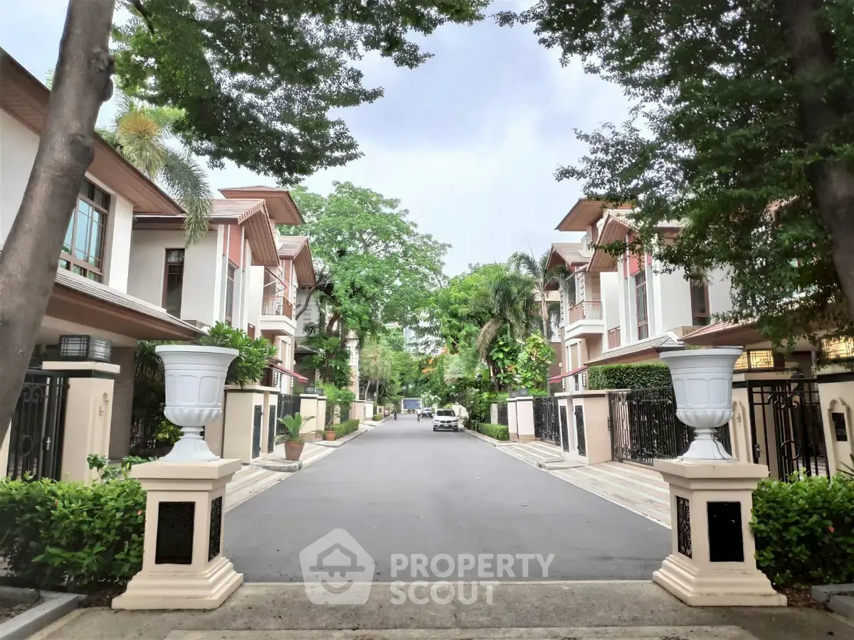 Charming residential street with elegant houses and lush greenery, perfect for serene living.