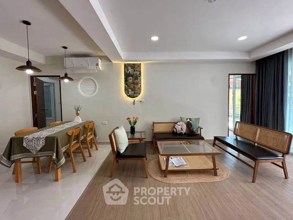 Spacious living room with modern furniture and dining area
