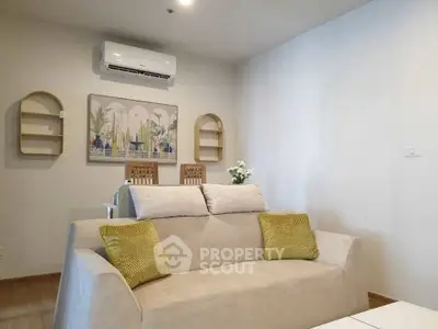 Modern living room with cozy beige sofa and stylish wall decor