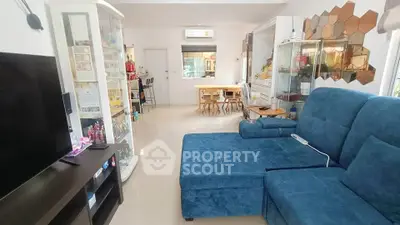 Spacious living room with modern blue sofa and elegant decor