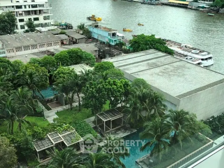 Luxurious riverside view with lush gardens and modern architecture, perfect for serene living.