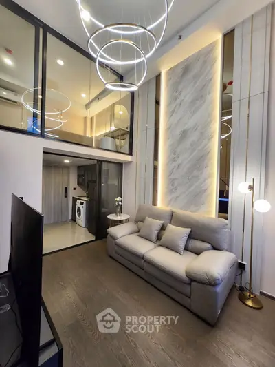 Luxurious modern living room with high ceilings and elegant lighting