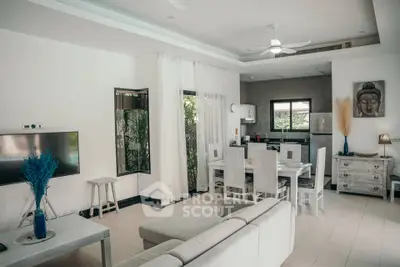Modern open-plan living room with dining area and stylish decor