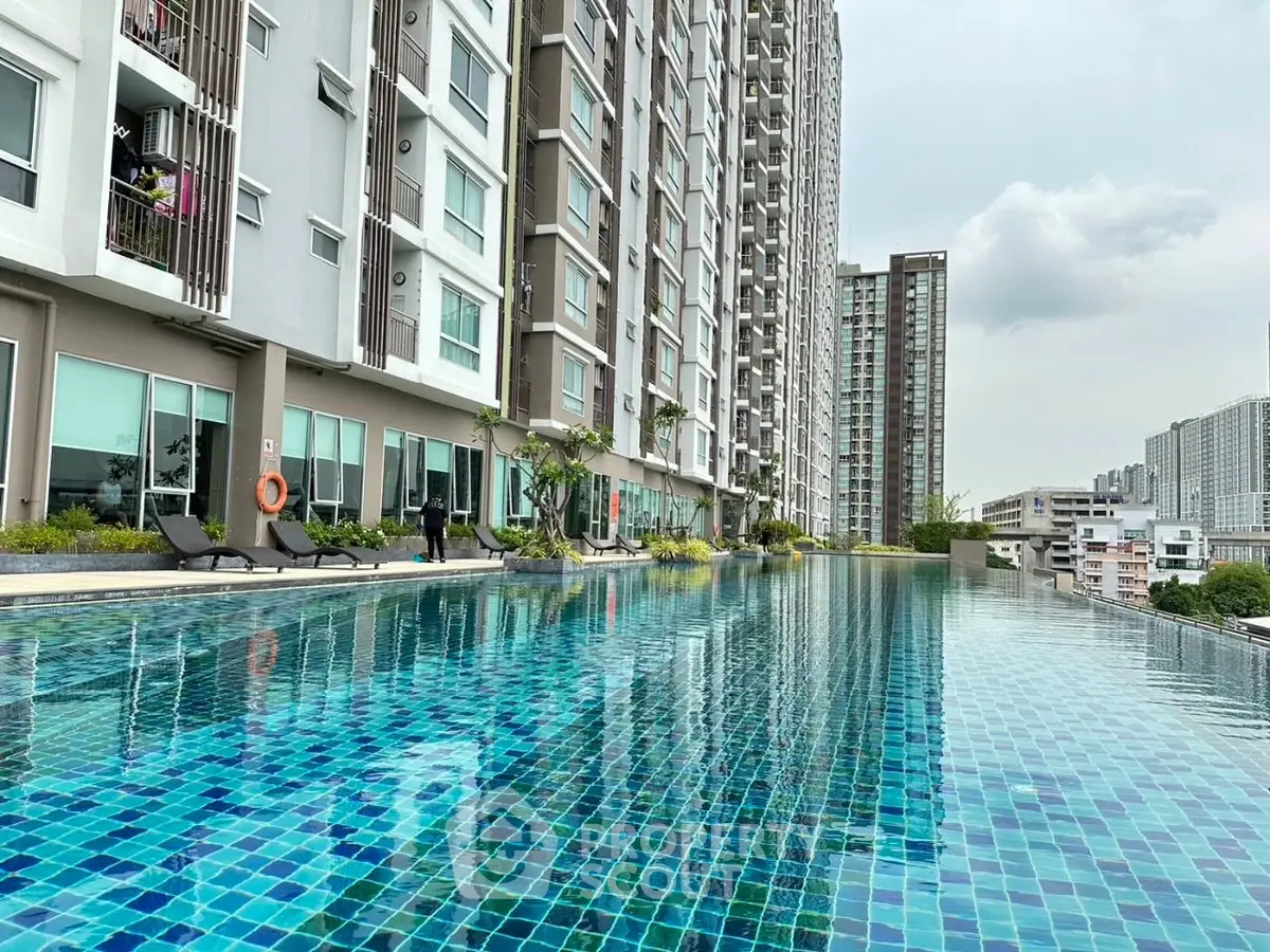 Luxurious high-rise building with stunning infinity pool and city views.