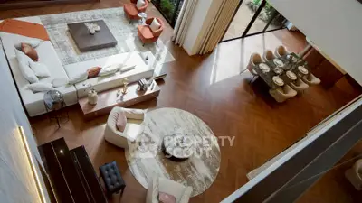 Luxurious open-plan living room with elegant dining area and stylish decor