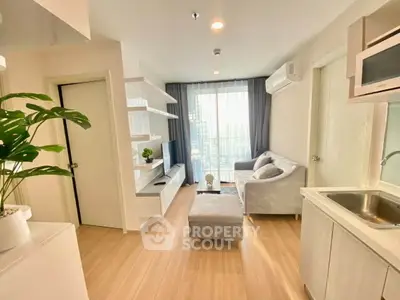 Modern living room with sleek design and natural light, featuring a cozy sofa and stylish shelving.
