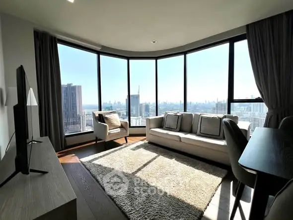 Luxurious living room with panoramic city views and modern furnishings.