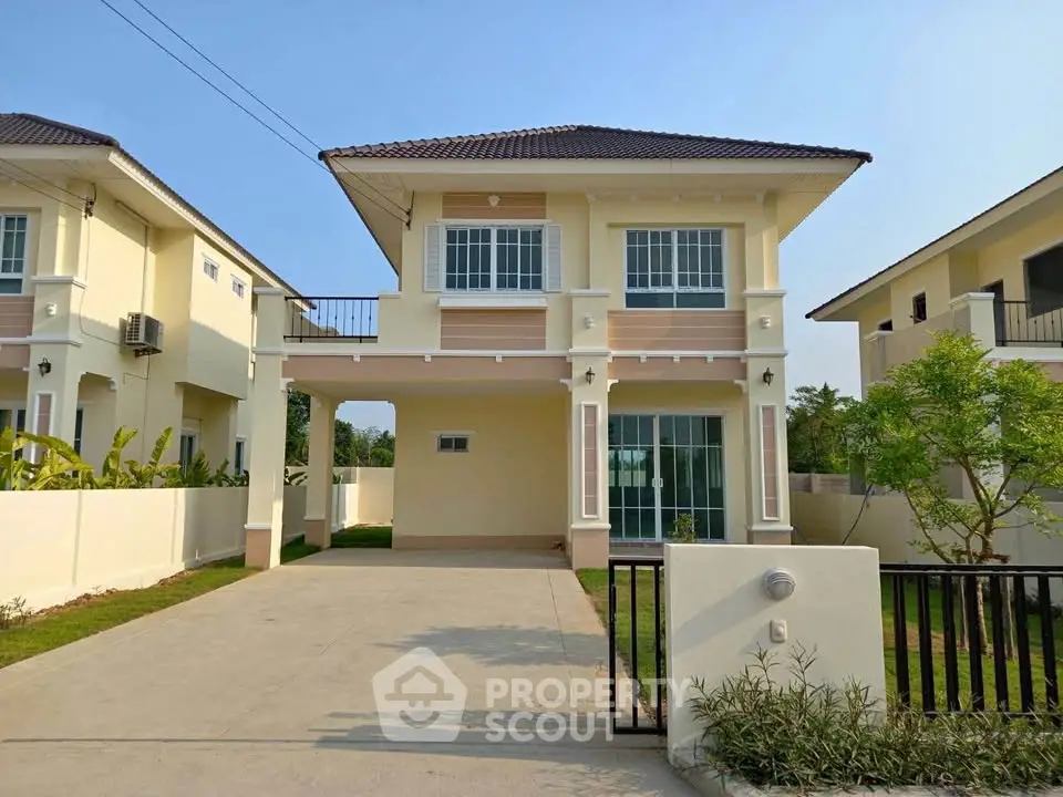 Charming two-story house with spacious driveway and lush greenery in a serene neighborhood.