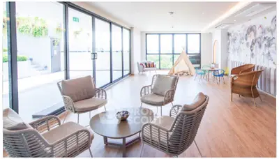 Spacious modern living room with large windows and stylish furniture