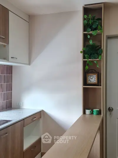 Modern kitchen with wooden cabinets and decorative shelving