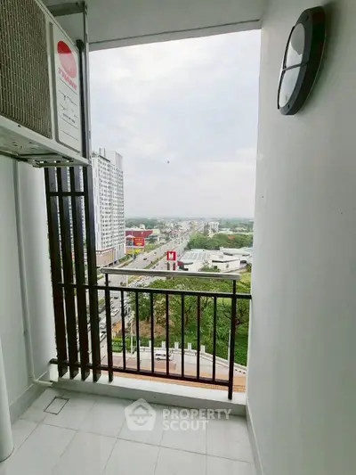 Stunning balcony view overlooking cityscape with modern high-rise buildings.
