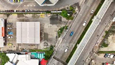 Aerial view of urban roads and buildings with parking area