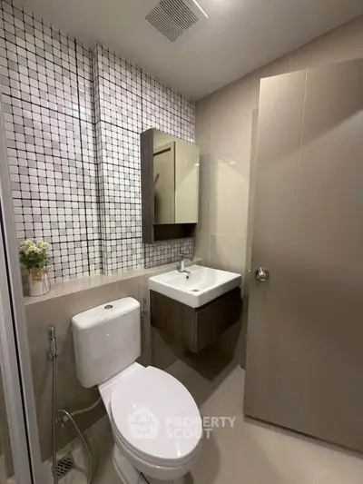 Modern bathroom with sleek fixtures and stylish tile design