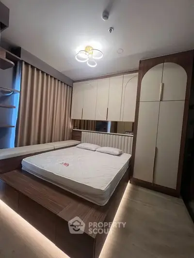 Modern bedroom with stylish built-in storage and ambient lighting