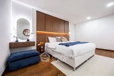 Luxurious modern bedroom with elegant wooden accents and cozy lighting