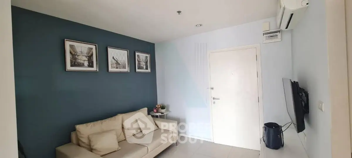Modern living room with stylish decor and comfortable seating in a contemporary apartment.