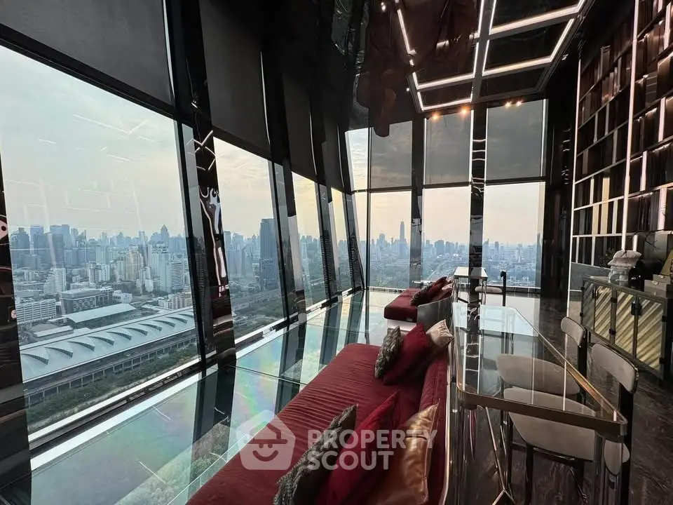 Luxurious high-rise living room with panoramic city views and elegant modern decor.