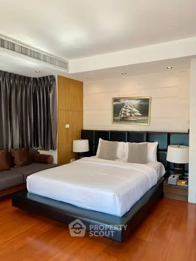 Luxurious bedroom with modern decor and elegant furnishings in a high-end property.