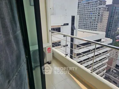 Modern high-rise balcony with city view and sleek railing design