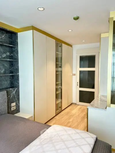Modern bedroom with sleek built-in wardrobe and elegant decor