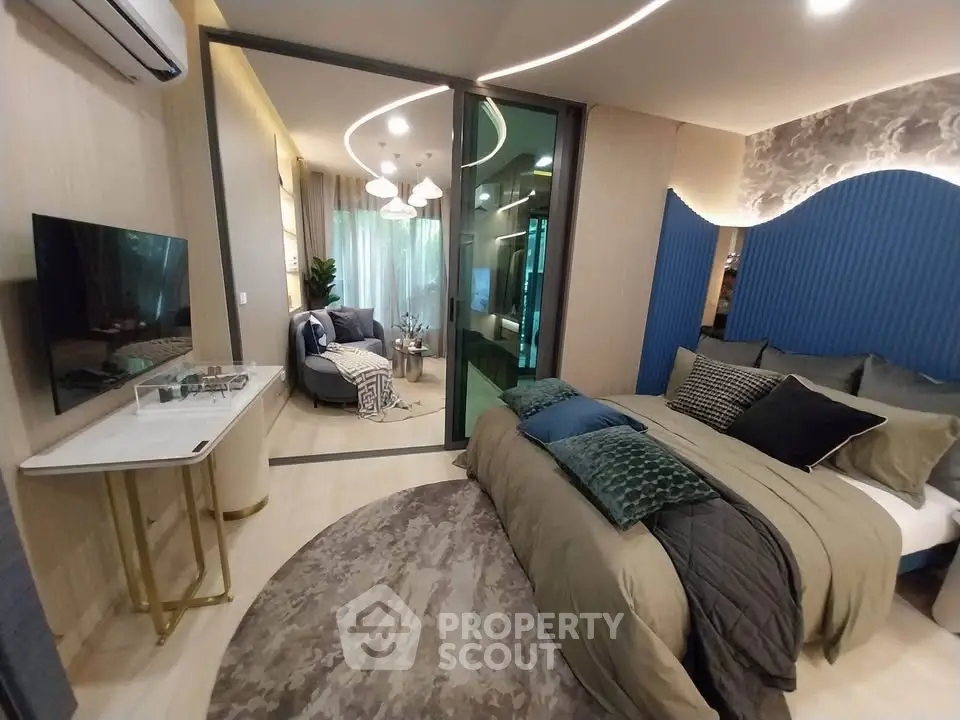 Luxurious modern bedroom with stylish decor and cozy seating area