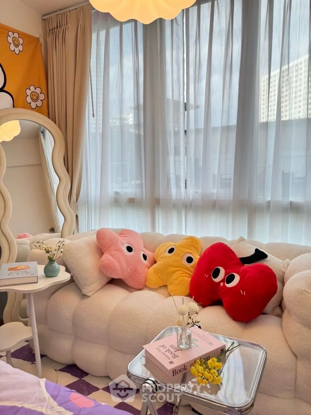 Charming living room with plush sofa and playful decor, perfect for cozy relaxation.