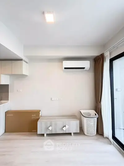 Modern living room with air conditioning and large window for natural light