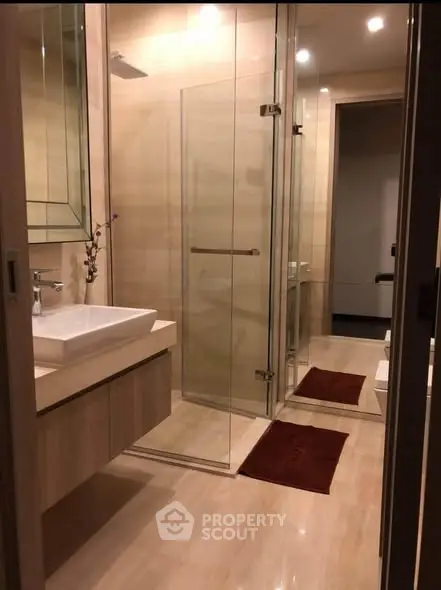 Elegant modern bathroom with glass shower and stylish vanity