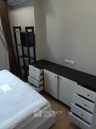 Modern bedroom with sleek storage solutions and minimalist design