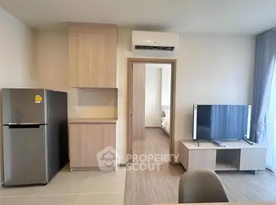 Modern apartment interior with sleek kitchen and cozy living area