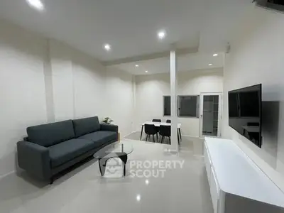 Modern living room with sleek furniture and minimalist design