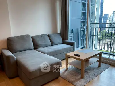 Modern living room with cozy sofa and city view balcony in urban apartment