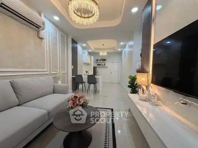 Luxurious modern living room with elegant chandelier and stylish decor