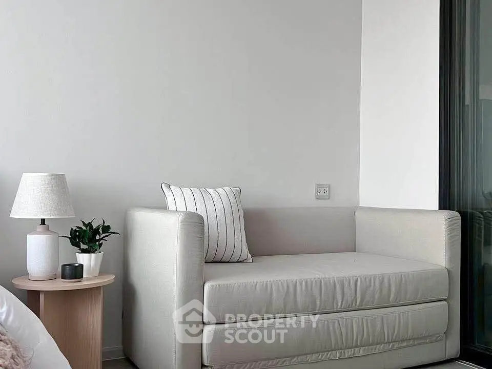 Modern living room with stylish sofa and side table in a bright apartment.