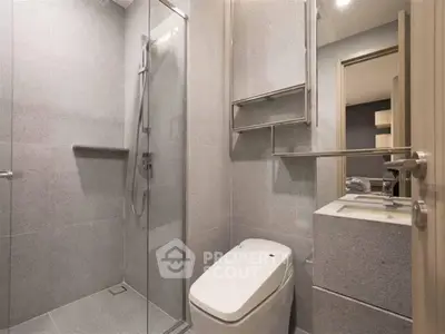 Modern bathroom with sleek design and glass shower enclosure