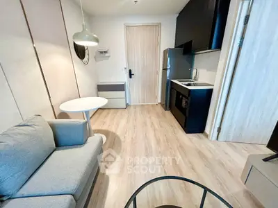 Modern compact living room with kitchenette and stylish decor