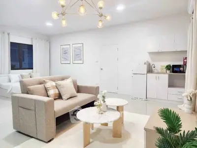 Modern open-plan living room with stylish decor and cozy ambiance