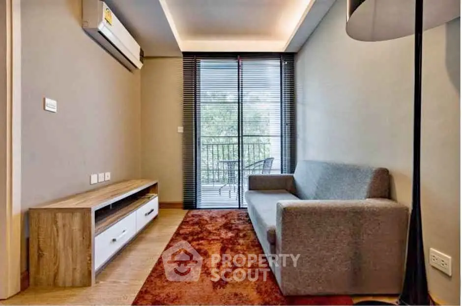 Cozy living room with modern sofa and balcony view