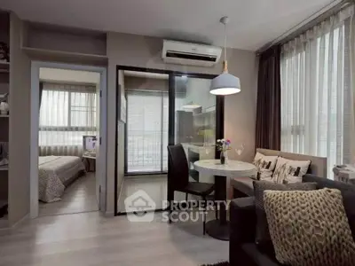 Modern apartment interior with cozy living room and dining area, featuring large windows and stylish decor.
