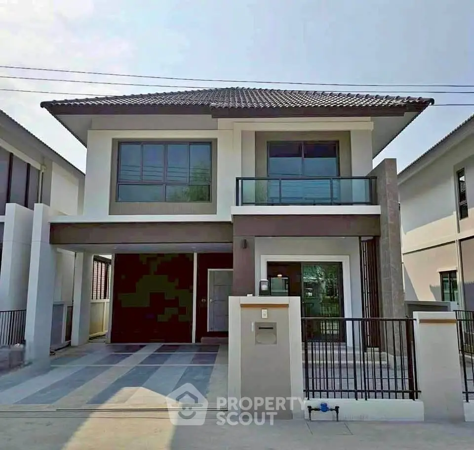 Modern two-story house with sleek design and spacious driveway