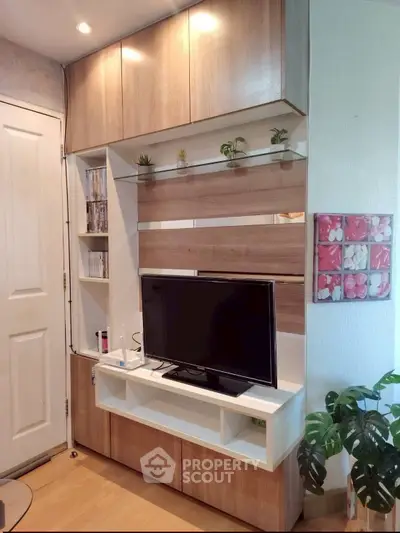 Modern living room with stylish wooden TV cabinet and decorative plants