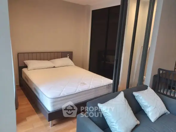 Modern studio apartment with cozy bedroom and stylish living area