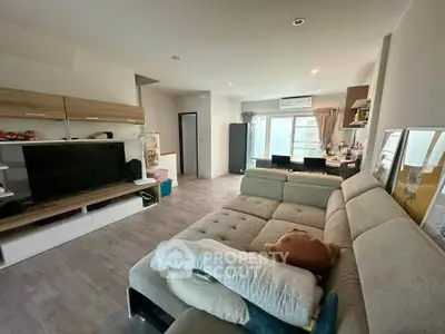 Spacious modern living room with stylish furniture and open layout, perfect for relaxation and entertainment.