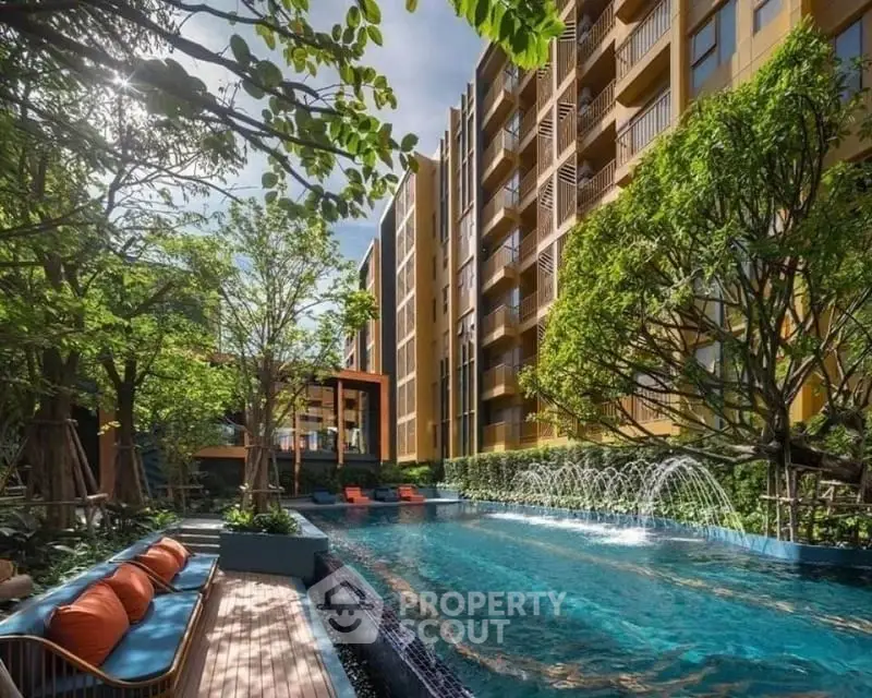 Luxurious apartment complex with stunning pool and lush greenery